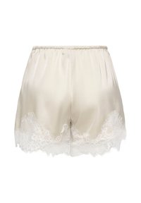 Shorts en satin crème avec taille élastique et bordure en dentelle florale blanche le long de l'ourlet.