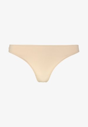 Beige katoenen string met een gladde textuur, elastische tailleband en minimale bedekking, met schone randen en geen zichtbare naden.