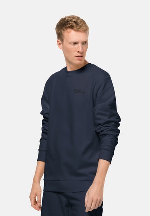 Marineblauer Sweatshirt aus weichem Stoff, mit Rundhalsausschnitt, langen Ärmeln und kleinem Logo auf der Brust.