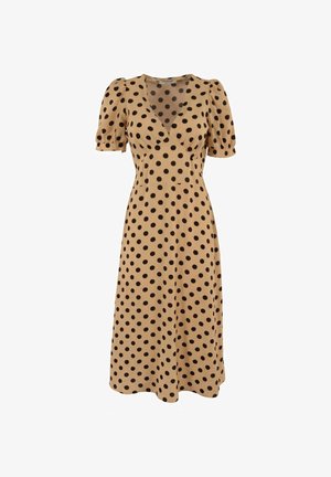 Vestido midi beige con lunares negros, escote en V, mangas cortas abullonadas y cintura ajustada.