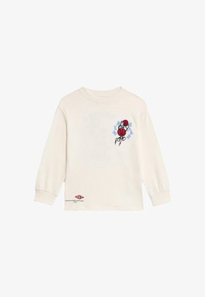 Kremowy longsleeve z haftowanym logo koszykówki z postacią. Wzór zawiera niebieskie i czerwone akcenty.