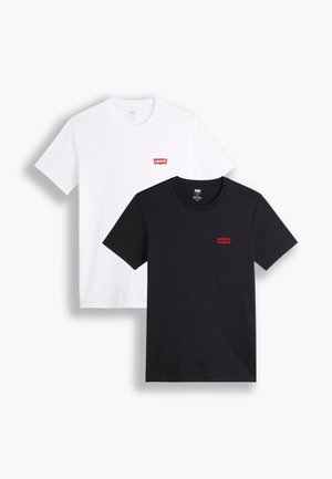Deux t-shirts à manches courtes : un blanc et un noir. Tous deux en coton avec un logo rouge de Levi's sur la poitrine. Design simple à col rond.