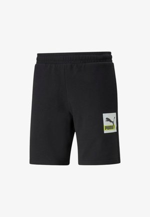 Pantaloni corti neri realizzati in tessuto morbido, con una vita elastica, tasche laterali e una patch con il logo Puma bianco e verde neon sulla parte anteriore.