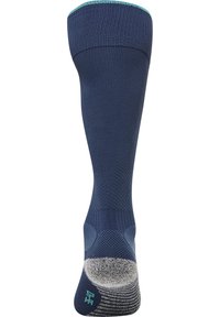 Granatowe skarpetki z prążkowaną fakturą i turkusowym mankietem. Posiadają wzmocnione obszary pięty i palców, gładką wkładkę dla komfortu.
