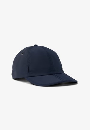 Navy blue baseball cap with stitching details and metal ventilation grommets, positioned on a white background.