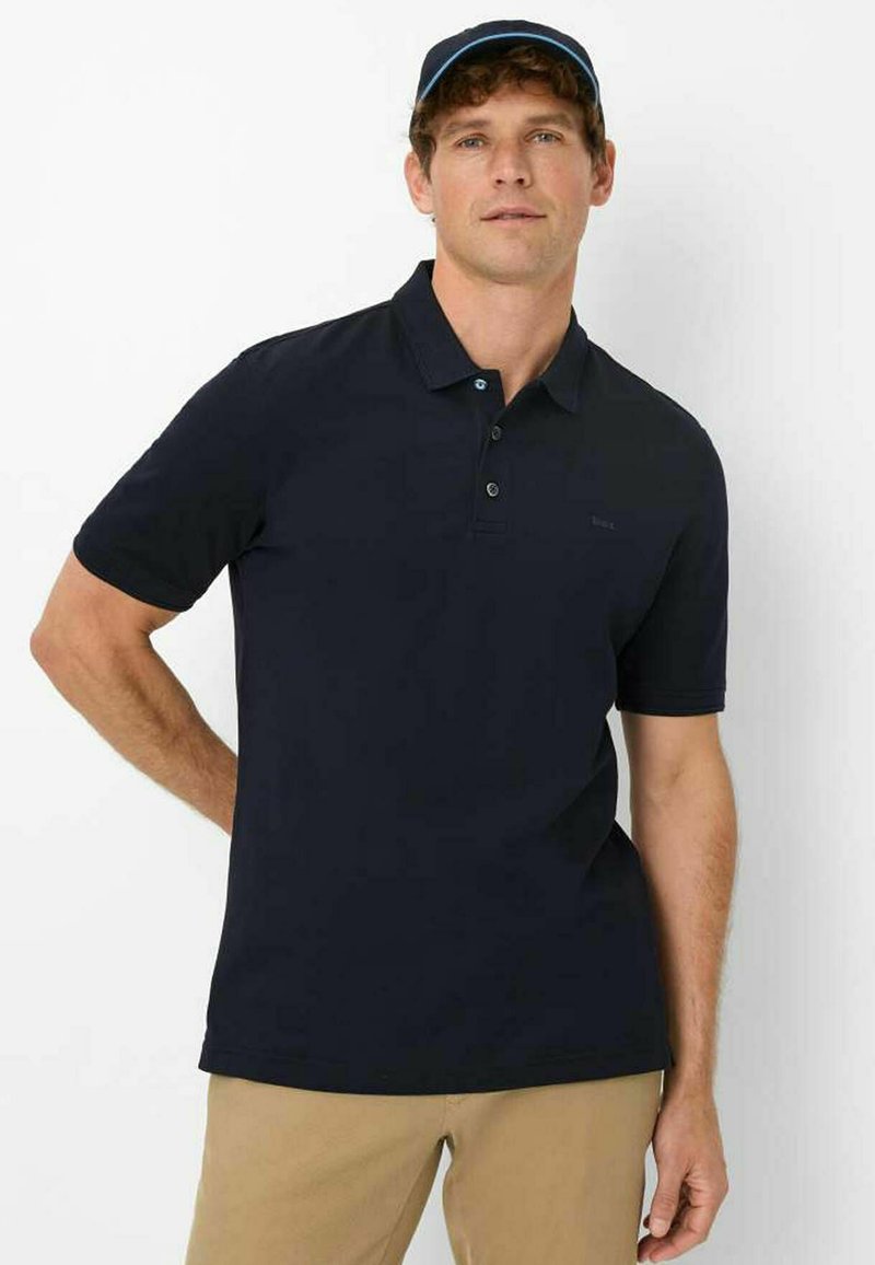 Navy polo shirt made of smooth cotton, featuring a classic collar, three-button placket, and a small logo detail on the chest.