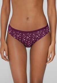 Burgunderfarbene Bikini-Höschen mit einem weichen Bund, ausgestattet mit einem kleinen Blumenmuster in Pink und Grün auf einem dunklen Hintergrund. Material aus Baumwollmischung.