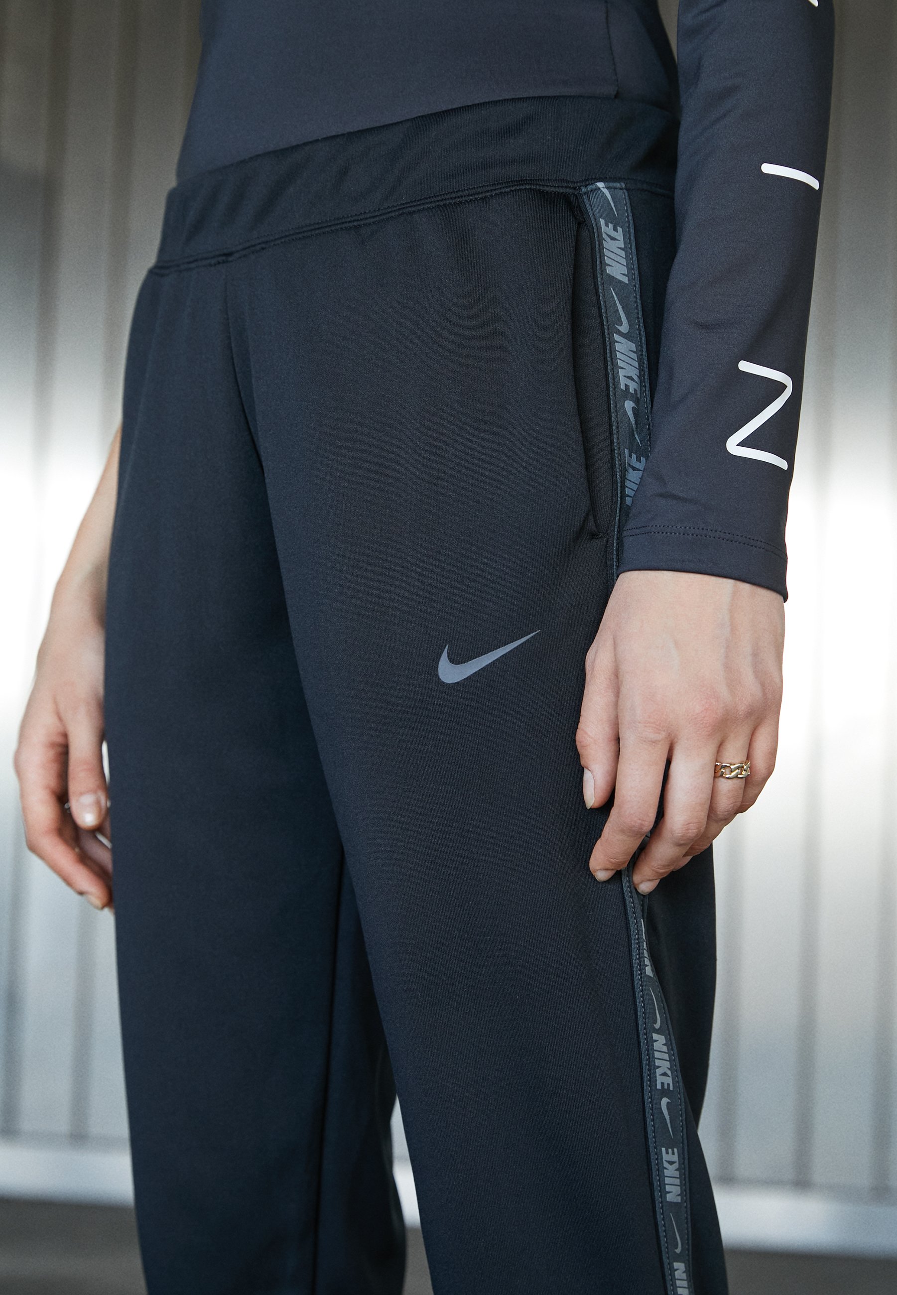 Nike taped tracksuit bottoms Clearance