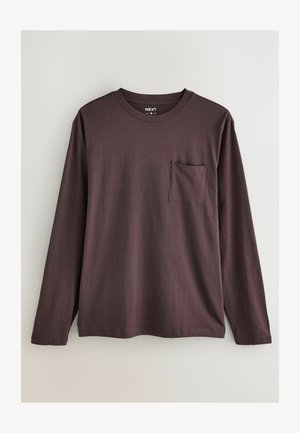 Dlouhý rukáv vínového trička vyrobeného z bavlny, s kulatým výstřihem a kapsičkou na hrudi. Měkká textura s volným střihem.