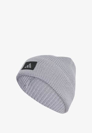 Gray knitted beanie hat with a ribbed texture and a black logo patch featuring three diagonal stripes. Soft material, close-fitting design.