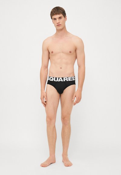 Schwarze Unterhosen mit einem weißen "SQUARED" Logo-Bund, aus glattem Stoff, mit schmaler Passform und minimalistischem Stil.