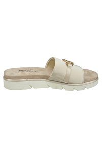 Beiga slide-sandaler med en bred rem, guldfärgad hårdvara, mjukt mockaskinn och en kraftig vit gummisula.
