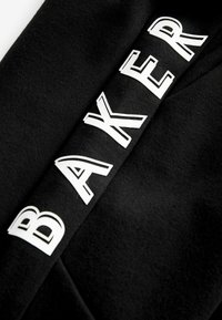 Next Verryttelyhousut - black