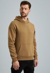 Brown hoodie made of soft fabric, featuring a front kangaroo pocket, ribbed cuffs, and a minimal embossed logo on the chest.
