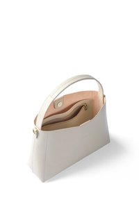 Helle beige Lederhandtasche mit strukturiertem Design und glatter Textur. Verfügt über einen einzelnen Griff und eine Innentasche mit Reißverschluss.
