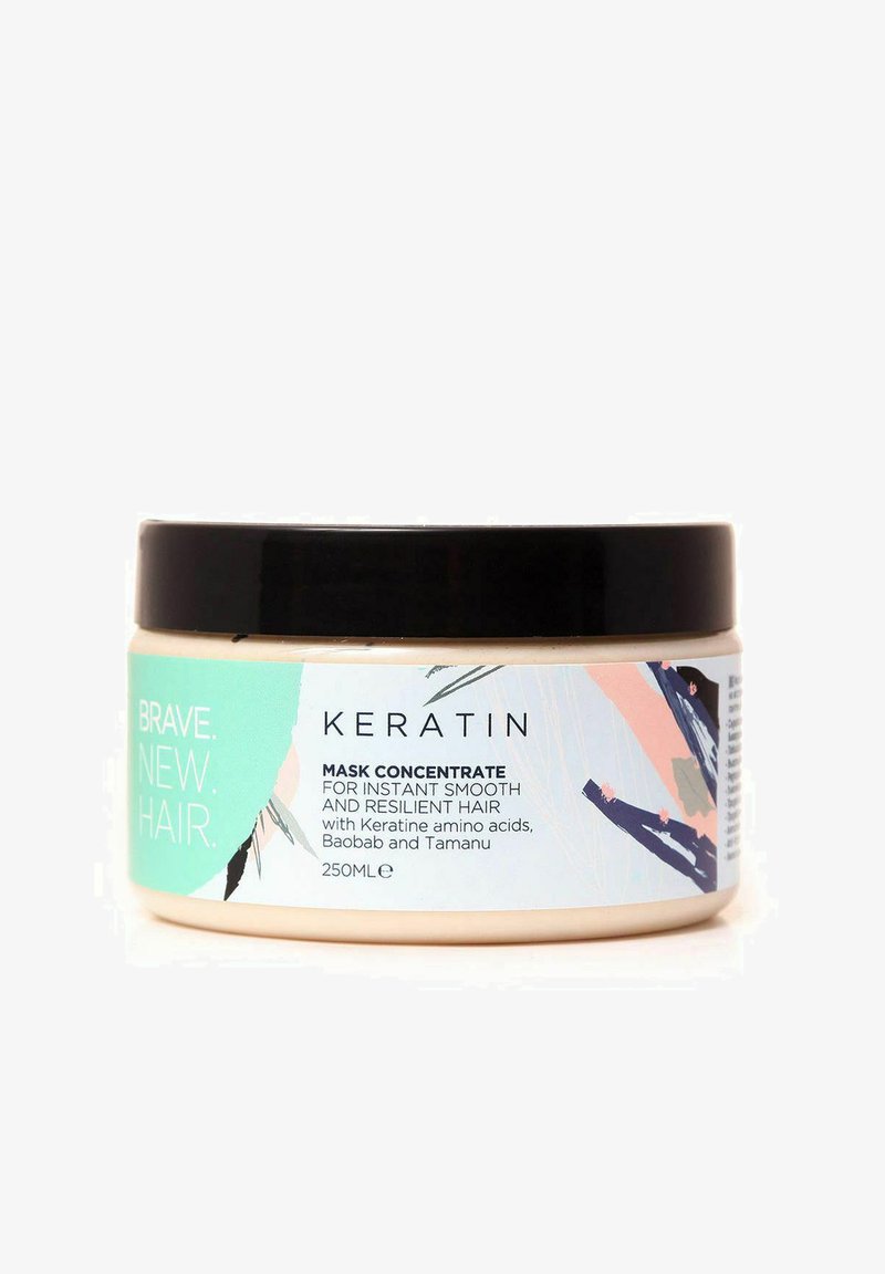 Keratin hårmaske i en rund beige beholder. Sort låg, farverig etikette med aquafarve, lyserød og sorte accenter. Indeholder 250 ml.