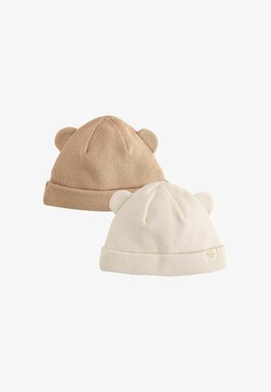 Two soft knit baby hats in beige and cream colors, each with small rounded ears on top for a cute, animal-inspired look.