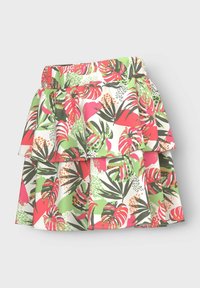 Jupe évasée avec un imprimé de feuilles tropicales multicolores aux teintes vives de rose, vert et blanc. Des couches volantées ajoutent de la texture et de la dimension.