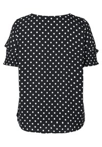 Svart blus med vita prickar, korta volangärmar och rund halsringning. Lätt tyg med en slät yta.