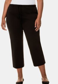 Zwarte capri-broeken met een elastische tailleband en trekkoord, met een relaxte pasvorm en een zachte katoen stof.