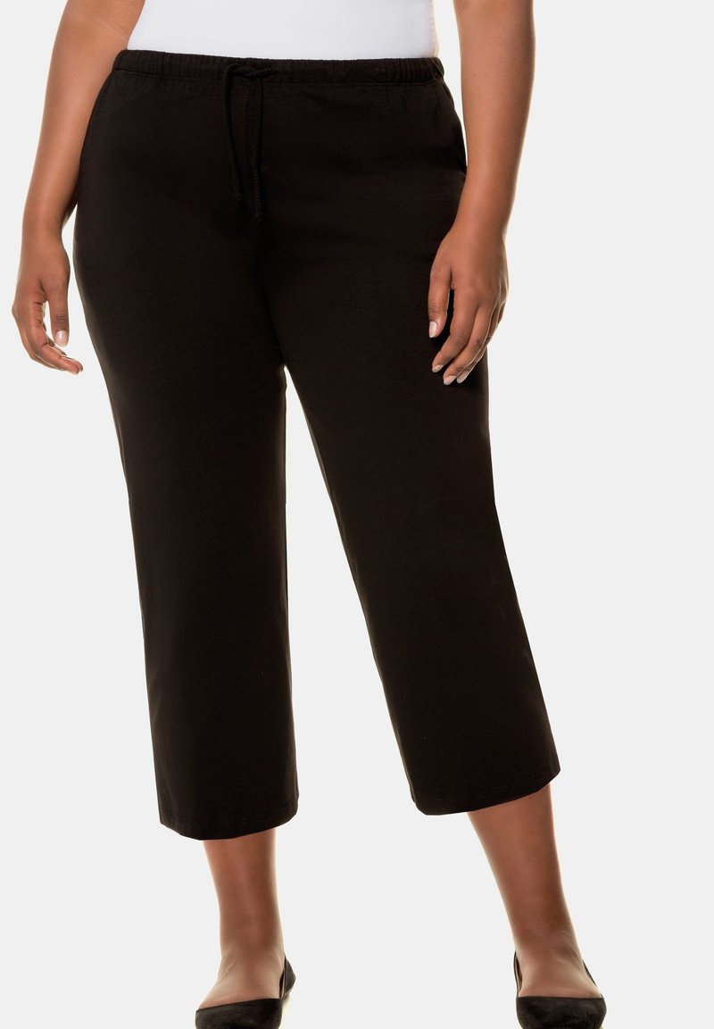 Zwarte capri-broeken met een elastische tailleband en trekkoord, met een relaxte pasvorm en een zachte katoen stof.