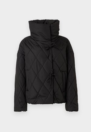 Black quilted puffer jacket with a high collar, featuring drawstring closures and two front pockets. Soft texture and oversized fit.