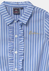Camicia a righe blu con un davanti arricciato, chiusura a bottoni e nome del marchio ricamato in oro. Tessuto di cotone liscio con collo a camicia.