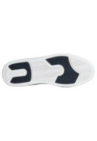 Semelle de sneaker blanche avec un motif en caoutchouc noir texturé au centre, présentant un design en chevrons, des bords arrondis, et le logo de la marque.