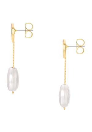 Gold stud earrings with vertical thin bars ending in irregular white pearl drops, shown from side view on a white background.