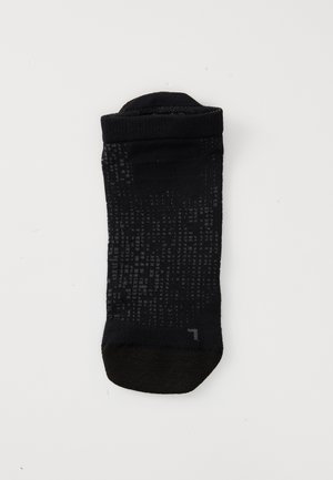 Schwarze Knöchel-Socken aus strukturiertem Material mit einem subtilen Muster, ausgestattet mit einer verstärkten Spitze und einem weichen, elastischen Bündchen am Öffnung.