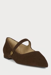 Brown suede flat shoes with a pointed toe, featuring a wide strap across the foot and a decorative button accent on the side.