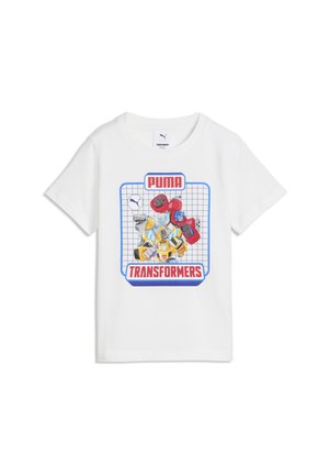 Camicia bianca maniche corte con grafica colorata del robot Transformers dentro una griglia blu, con loghi Puma e Transformers in rosso.