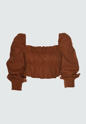Top court marron avec des manches bouffantes, un buste froncé et des volants. Fabriqué en tissu doux avec une texture froncée sur les manches et l'ourlet.