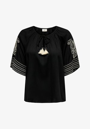 Svart blus med korta, lösa ärmar, prydd med vita broderade detaljer och fransar vid halsringningen. Slätt tyg med en avslappnad passform.