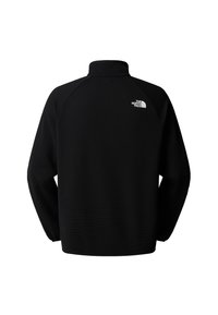 Pullover in pile nero con collo alto, tessuto texturizzato e maniche raglan. Presenta un piccolo logo bianco sul retro.