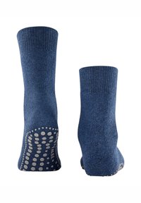 Calcetines de algodón azules con un puño acanalado y una suela texturizada antideslizante de puntos para un mejor agarre. Textura suave con un color uniforme en toda su superficie.