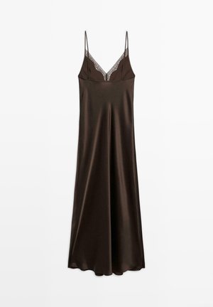 Brown satin slip dress with adjustable spaghetti straps. Features a delicate lace trim along the neckline and falls to mid-calf length.