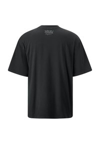 Black short-sleeve t-shirt, loose fit, made from cotton, featuring a small logo in gray at the back neckline. Smooth texture, no patterns.