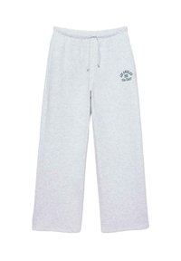 Hellgraue Jogginghose aus weichem Stoff, mit weitem Beinschnitt, elastischem Bund und einem bedruckten Logo auf der Vorderseite.