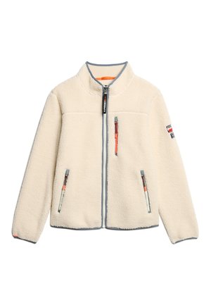 Fleece jacket in cream with a high collar, full zip front, two zippered pockets, and contrasting grey trims, featuring orange accent details.