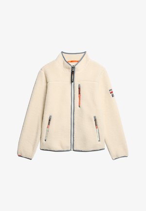 Veste en polaire crème avec un col haut, fermeture éclair intégrale à l'avant, deux poches zippées et des détails en gris contrastant, présentant des accents orange.