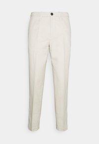 Pantalon beige, coupe ajustée, tissu léger, jambe droite, plis avant, fermeture par un seul bouton et poches latérales.
