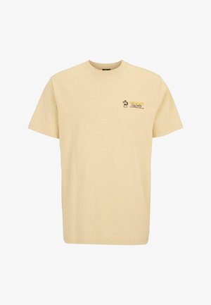 T-shirt in cotone beige con maniche corte, caratterizzata da un piccolo design grafico e testo nella zona sinistra del petto. Stile classico con colletto a girocollo.