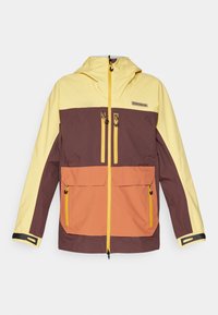 Vattentålig jacka med gula, bruna och orange paneler, dragkedja framtill, två bröstfickor och justerbara ärmslut.