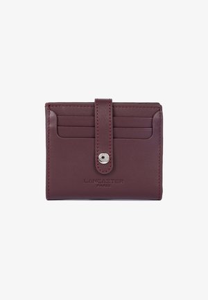 Burgundy leather wallet with snap closure, four card slots, and Lancaster Paris logo embossed on front.