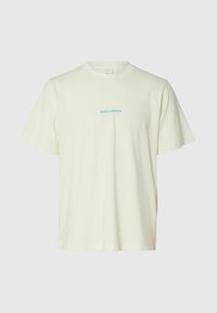T-shirt blanc cassé à manches courtes en coton avec un petit texte bleu "Hotel Amour" centré sur la poitrine, col rond, coupe décontractée.