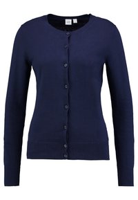 Mörkblå cardigan tillverkad av ett fint stickat material, med rund halsringning, långa ärmar, ribbade muddar, knappstängning framtill och en åtsittande design.