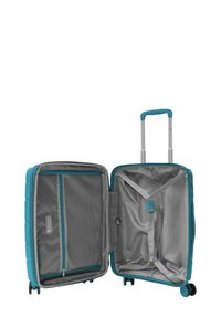 Valigia rigida color turchese con interni grigi, dotata di una tasca a rete con zip, cinghie regolabili e manico estensibile, su ruote.