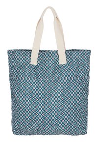 Geweven tote bag in teal stof, met een geometrisch ontwerp in wit en rood. Twee handvatten van beige stof om te dragen.