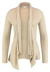 Beige ribbad cardigan med långa ärmar, öppen frontdesign och utsvängd nederkant. Tillverkad av mjukt, texturerat tyg med en avslappnad passform.